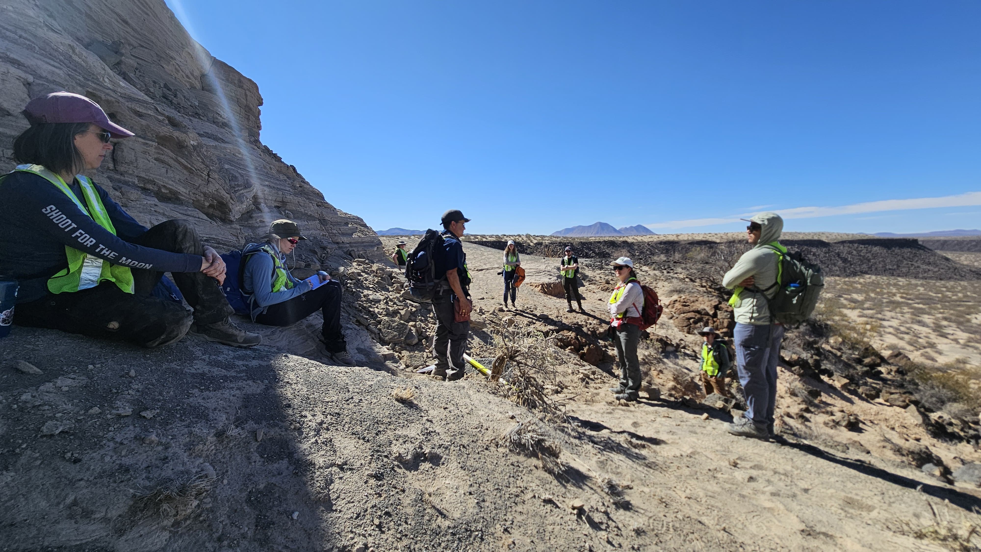 image of geologists looking at outcrop